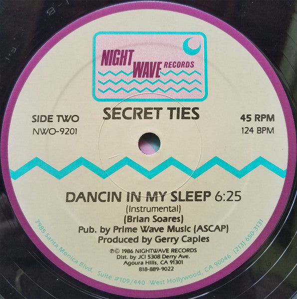 Rectangle Triangle Dancin' In My Sleep album cover art featuring colorful, abstract geometric shapes on a dark background.
