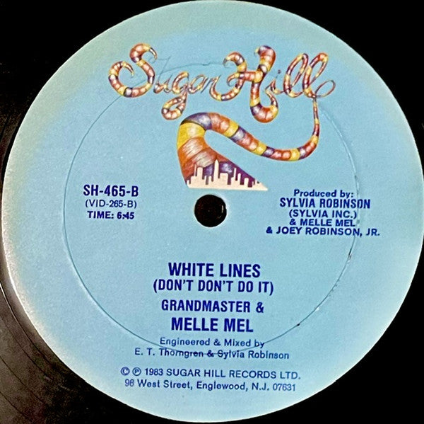 Rectangle Triangle White Lines (Don't Don't Do It) and Melle Mel's Groove vinyl record with album cover art.