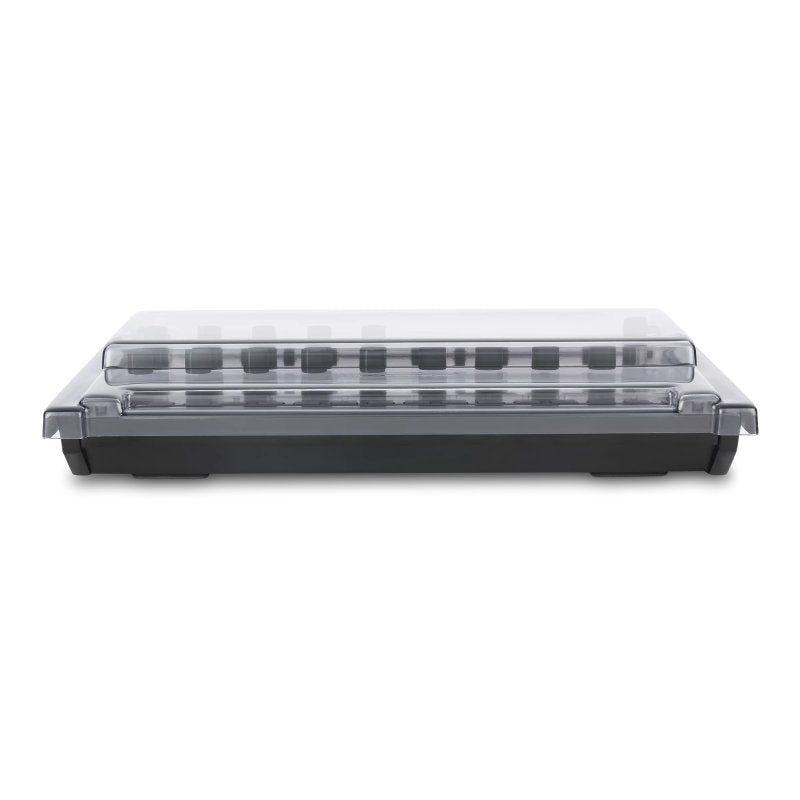 Decksaver cover for Korg Drumlogue groovebox, showing a clear protective plastic cover over the device with branding on the cover.