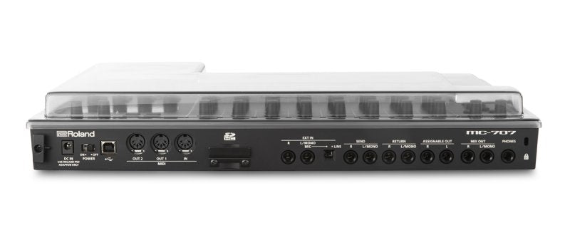 Decksaver Roland MC-707 groovebox cover protecting the electronic music device from dust and impacts.