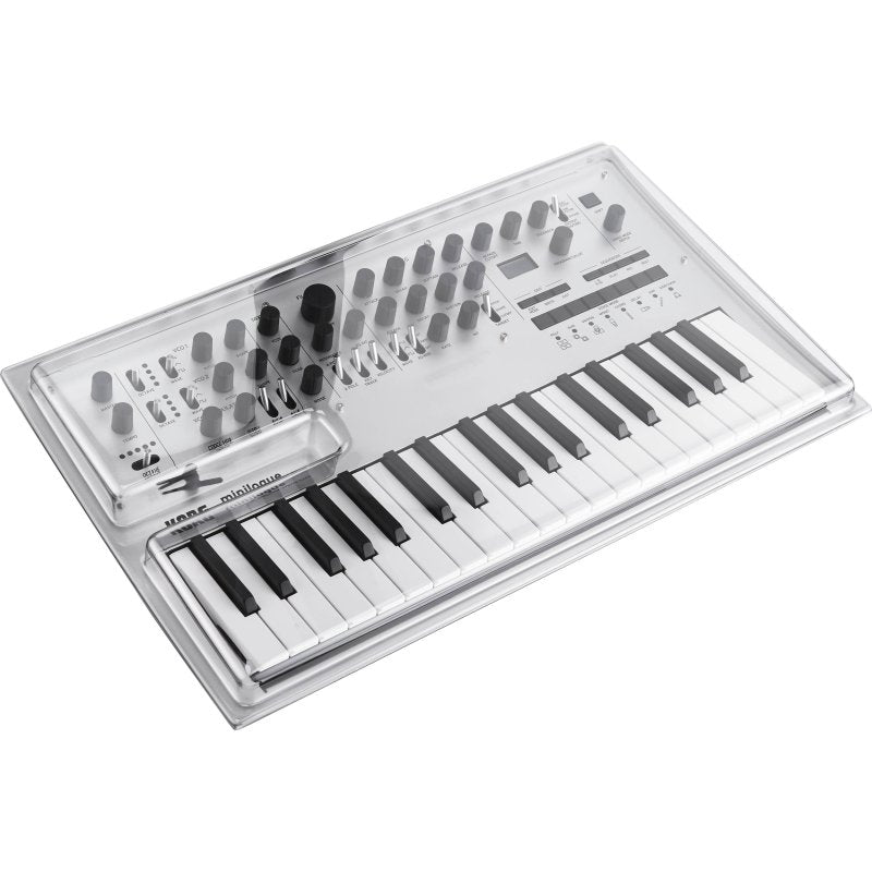 Decksaver Korg Minilogue synth cover in smoked and clear plastic, designed to protect the synthesizer from dust and damage.