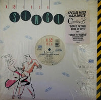 Signed copy of "In Your Book Of Love" album by Sticky Fingers, with Rectangle Triangle branding, featuring album cover art.