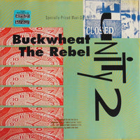 Buckwheat The Rebel by Rectangle Triangle, featuring a rustic packaging design with fresh buckwheat grains in a clear bag.