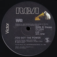 Rectangle Triangle's "You Got The Power" graphic T-shirt featuring bold text on a black fabric background.