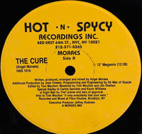 Close-up of a Rectangle Triangle The Cure album cover artwork with bold geometric shapes and vibrant colors.