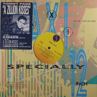 Rectangle Triangle A Zillion Kisses vinyl record album with colorful abstract cover art on a turntable.