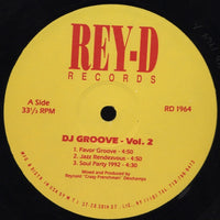 Cover art for DJ Groove Vol. 2 by Rectangle Triangle, featuring vibrant geometric design and bold typography.