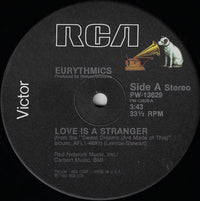 Rectangle Triangle Love Is A Stranger album cover featuring abstract artwork with bold shapes and vibrant colors.