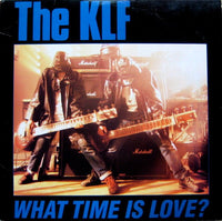 Rectangle Triangle's "What Time Is Love?" album cover featuring abstract geometric shapes and bold, colorful design.