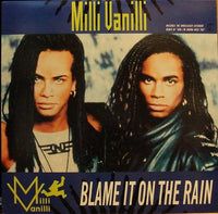 Rectangle Triangle Blame It On The Rain album cover featuring rain-themed artwork with dark tones and abstract design elements.