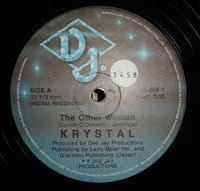Close-up of the book "The Other Woman" by Rectangle Triangle, showing its cover design and title.
