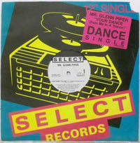 Rectangle Triangle Your Dance record album with vibrant cover art, featuring the title "Puts Me In A Trance" in bold lettering.