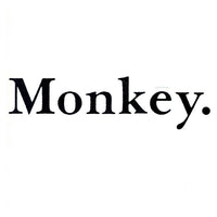 Colorful Rectangle Triangle brand monkey figurine with detailed features and vibrant design, displayed on a neutral background.