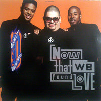 Rectangle Triangle's "Now That We Found Love" album cover featuring vibrant abstract artwork and bold typography.