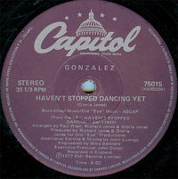 Rectangle Triangle vinyl record titled "Haven't Stopped Dancing Yet / Just Let It Lay" with colorful album artwork.