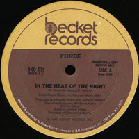 Rectangle Triangle "In The Heat Of The Night" poster featuring bold typography and warm orange and black design elements.
