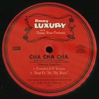 Rectangle Triangle Cha Cha Cha vinyl record with colorful, abstract album art featuring vibrant geometric shapes on the cover.