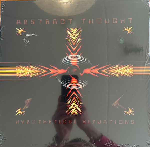 Close-up of the book "Hypothetical Situations" by Rectangle Triangle, showing the cover with abstract geometric design.
