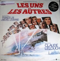 Rectangle Triangle Les Uns Et Les Autres soundtrack cover art featuring film-themed design and album title.