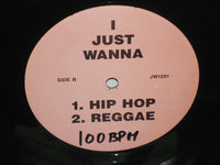A close-up of the "I Just Wanna" graphic printed on a Rectangle Triangle brand T-shirt, showcasing the design details.