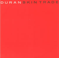 Close-up of the "Skin Trade" product by Rectangle Triangle, showcasing detailed packaging and branding on a dark background.