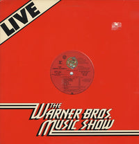 Rectangle Triangle Warner Bros. Music Show live poster featuring colorful cartoon characters and musical instruments.