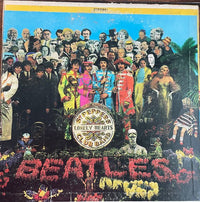 Rectangle Triangle Sgt. Pepper’s Lonely Hearts Club Band album cover art featuring vibrant, colorful imagery and iconic design elements.