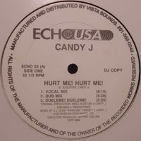 Close-up of the "Hurt Me! Hurt Me!" t-shirt by Rectangle Triangle featuring bold black text on white fabric.