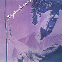 Rectangle Triangle Bryan Adams album cover featuring bold geometric shapes and vibrant colors.