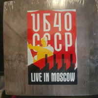 Rectangle Triangle CCCP live album cover featuring a vivid Moscow cityscape with bold typography and vibrant colors.