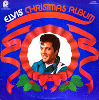 Rectangle Triangle Elvis' Christmas Album cover art featuring holiday-themed graphics and classic Elvis Presley imagery.