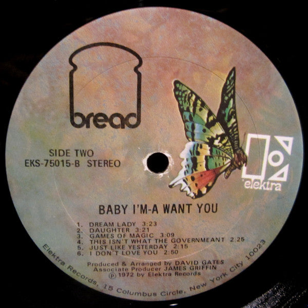 Rectangle Triangle Baby I'm-A Want You album cover featuring colorful abstract artwork and the artist's title in bold text.