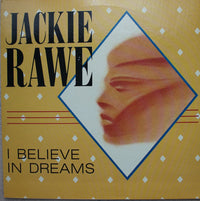 Close-up of a decorative "I Believe In Dreams" wall art sign by Rectangle Triangle, featuring elegant lettering on a neutral background.
