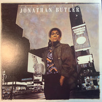 Portrait of a man named Jonathan Butler, featuring his facial features and hairstyle, against a neutral background.