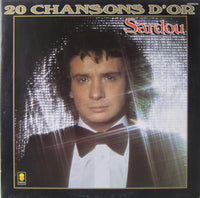 Cover image of 20 Chansons D'or album by Rectangle Triangle with gold-themed design and musical notes.