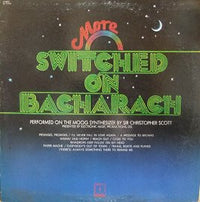 Rectangle Triangle More Switched On Bacharach music album cover featuring abstract geometric shapes and vibrant colors.
