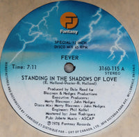 Rectangle Triangle Standing In The Shadows Of Love 2 album cover with dark, shadowy imagery and bold typography.