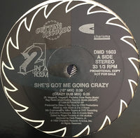 Rectangle Triangle's "She's Got Me Going Crazy" music album cover featuring vibrant abstract artwork.