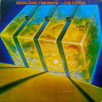 Close-up of a rectangle and triangle-shaped "The Force" logo by Rectangle Triangle on a sleek surface.