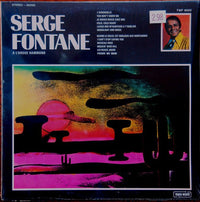 Serge Fontane playing Hammond organ, performing on stage with vintage music equipment, in a live concert setting.
