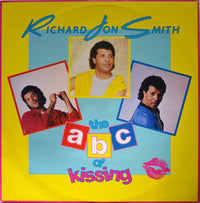Cover image of "The ABC Of Kissing" extended version book by Rectangle Triangle, featuring colorful lettering and playful design.