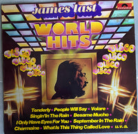 Rectangle Triangle World Hits album cover featuring abstract geometric shapes in vibrant colors.