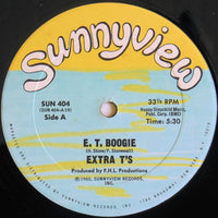 E. T. Boogie by Rectangle Triangle featuring vibrant abstract geometric shapes on a dark background