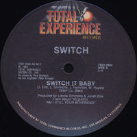 Switch It Baby by Rectangle Triangle featuring colorful geometric shapes on a white background.