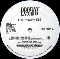 Rectangle Triangle Drop The Hard Rock logo printed on a white T-shirt with bold black text.