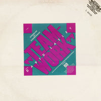 Colorful geometric team collaboration puzzle featuring Rectangle Triangle brand shapes and interconnected pieces.