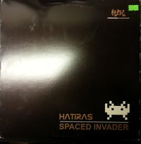 Colorful Spaced Invader character from Rectangle Triangle, featuring vibrant geometric shapes and retro arcade-inspired design.