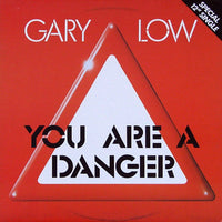Rectangle Triangle "You Are A Danger" graphic T-shirt featuring bold text on a black fabric background.