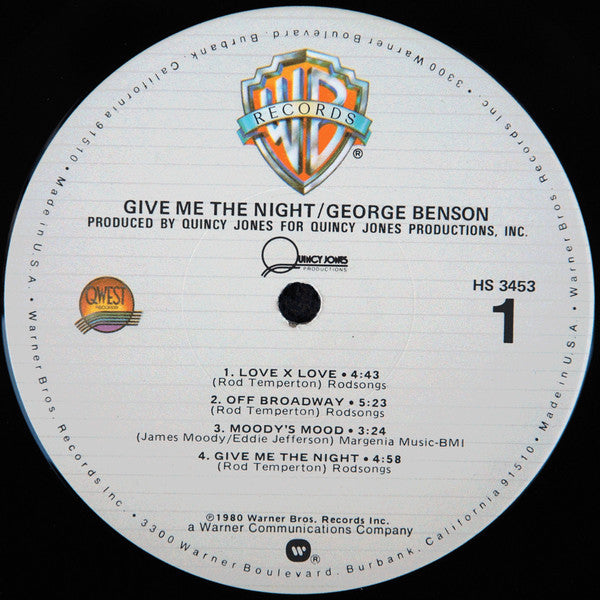 Rectangle Triangle's Give Me The Night album cover art featuring abstract dark and vibrant shapes on a black background.