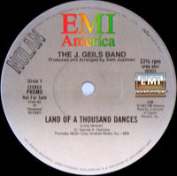 Rectangle Triangle Land Of A Thousand Dances album cover with vibrant abstract artwork and bold typography.